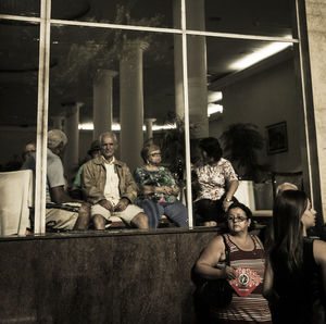 People sitting in front of building