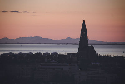 Silhouette of buildings at waterfront