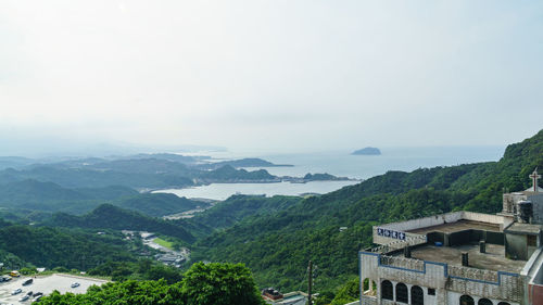 High angle view of buildings and mountains against sky