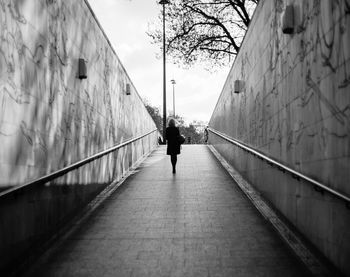 Full length of woman walking on walkway