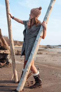 Fashion woman at seashore in autumn