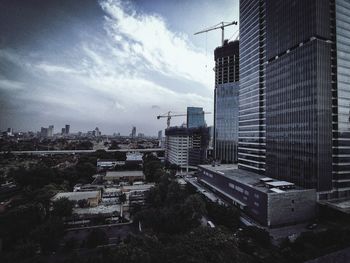 Modern buildings in city against sky