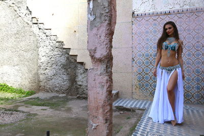 Portrait of beautiful young bellydancer wearing her belly dancing outfit and standing outdoors