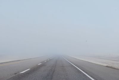 Road against sky during foggy weather