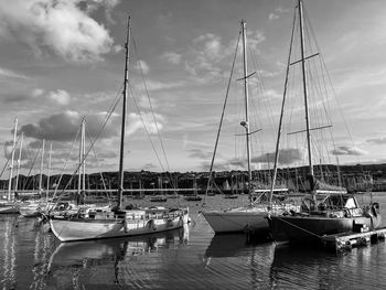 Boats moored at harbor