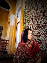 Portrait of woman sitting in temple