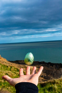 Close-up of hand holding ball