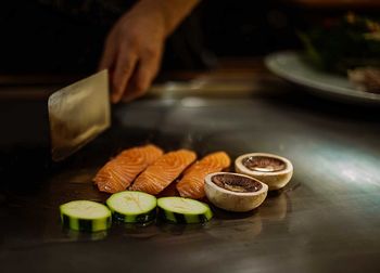 Close-up of preparing food on table