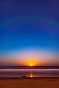 Scenic view of sea against sky at night