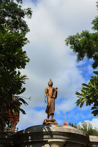 Low angle view of statue against sky