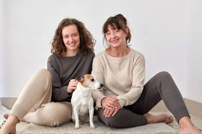 Portrait of smiling women with dog