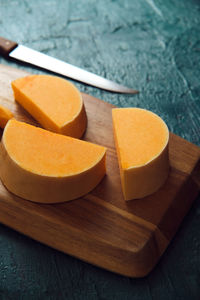 Pieces of pumpkin cut on a wooden board