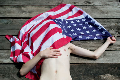 Close-up of boy with american flag