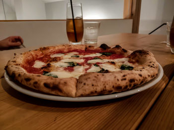 Close-up of pizza served on table