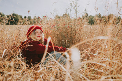 Woman sitting on field