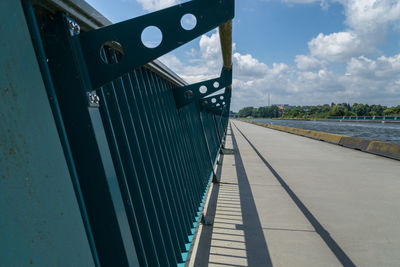 Close-up of railing against sky