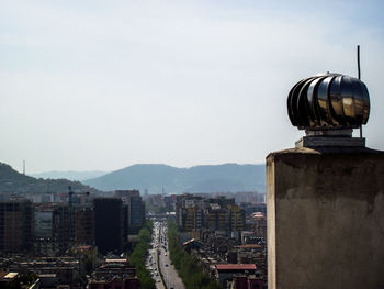 Buildings in city against sky