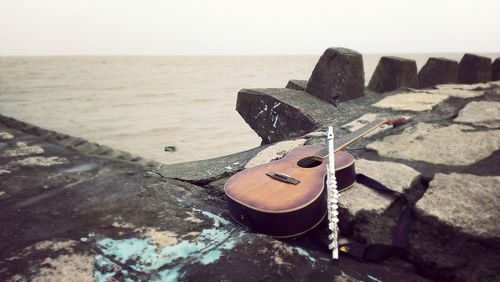 View of guitar on beach