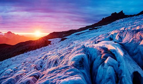 Scenic view of mountains during sunset