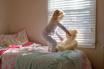 Close-up of stuffed toy on bed at home