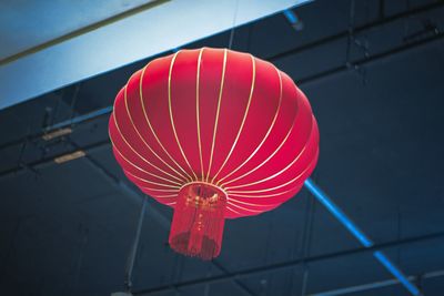 Low angle view of illuminated lanterns hanging on ceiling