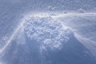 High angle view of snowflakes on snow