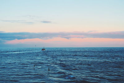 Scenic view of sea against cloudy sky