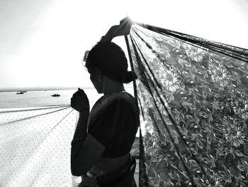 Close-up of woman against sky