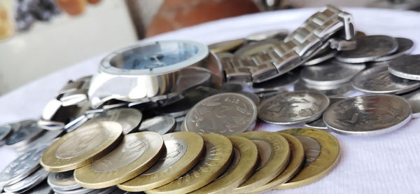 High angle view of coins on table