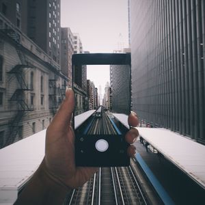 Cropped image of man looking through window