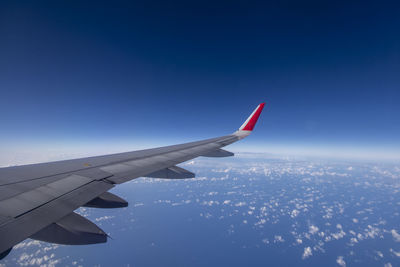 Airplane flying over blue sky