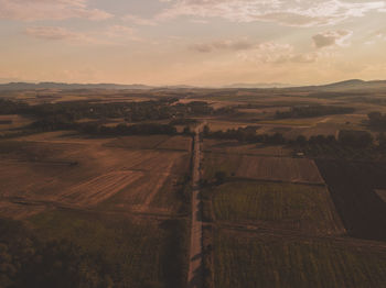 High angle view of field against sky during sunset