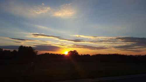 Scenic view of sunset over landscape