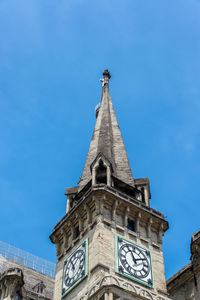 Low angle view of clock tower against sky