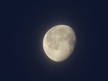 Low angle view of moon against clear sky at night