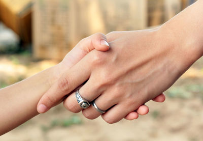 Cropped image of friends doing handshake