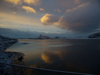 Scenic view of sea against dramatic sky