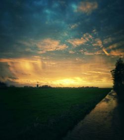 Scenic view of landscape against cloudy sky