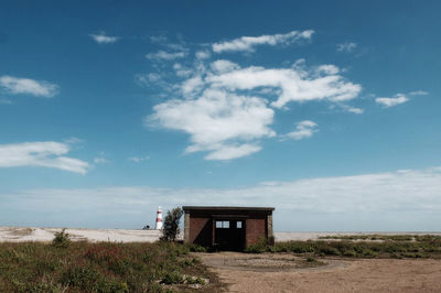 Built structure on beach against sky