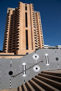 Low angle view of building against clear blue sky