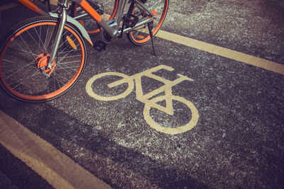 High angle view of bicycle sign on road