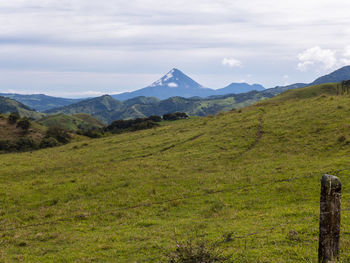 The volcano arenal at la fortuna in costa rica. the volcano has a classic shape of a cone.