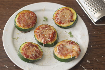 High angle view of pizza served on table