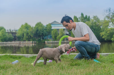 Side view of a dog on field