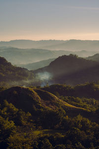 Scenic view of mountains against sky during sunset