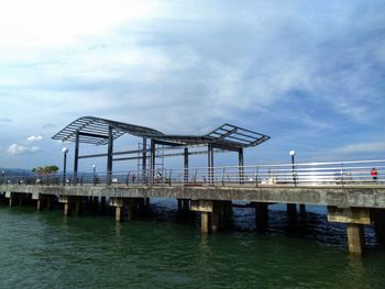 Pier over sea against sky