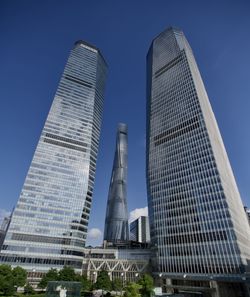Low angle view of modern buildings against sky