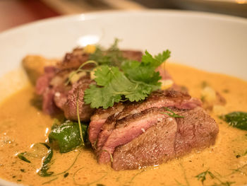 Close-up of meat served in plate on table