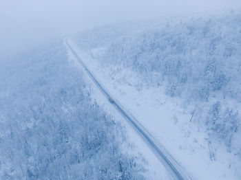 Aerial view of snow covered land