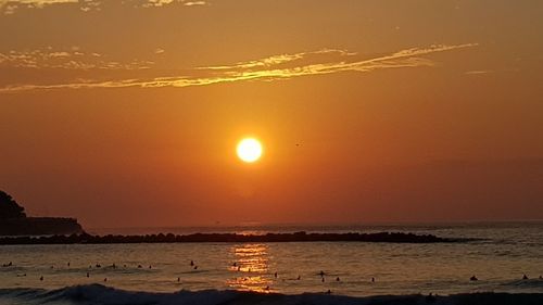 Scenic view of sea against sky during sunset